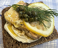 Lemon and capers Danish open sandwich with salmon and cheese spread