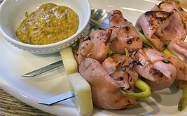 Mortadella skewers with cubes of provolone and Piparra peppers